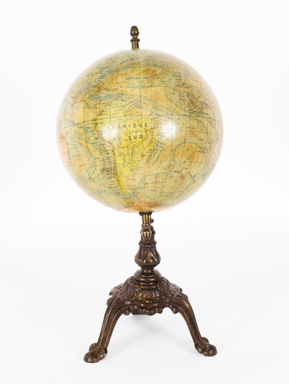 An antique 1880 French terrestrial globe mounted on a brass half-meridian ring and a decorative cast metal tripod base. View III