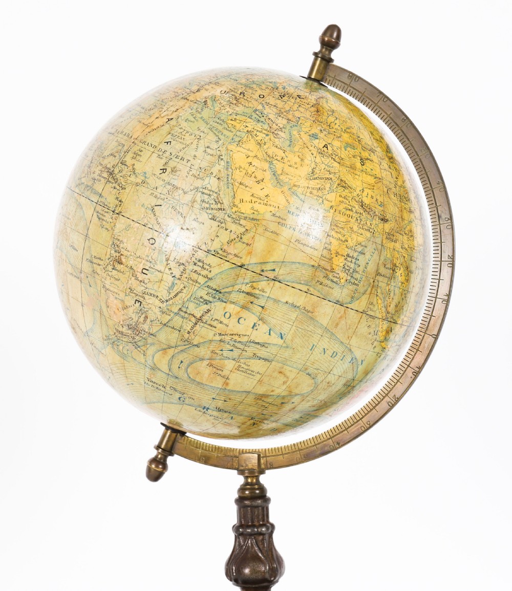 An antique 1880 French terrestrial globe mounted on a brass half-meridian ring and a decorative cast metal tripod base. View VI