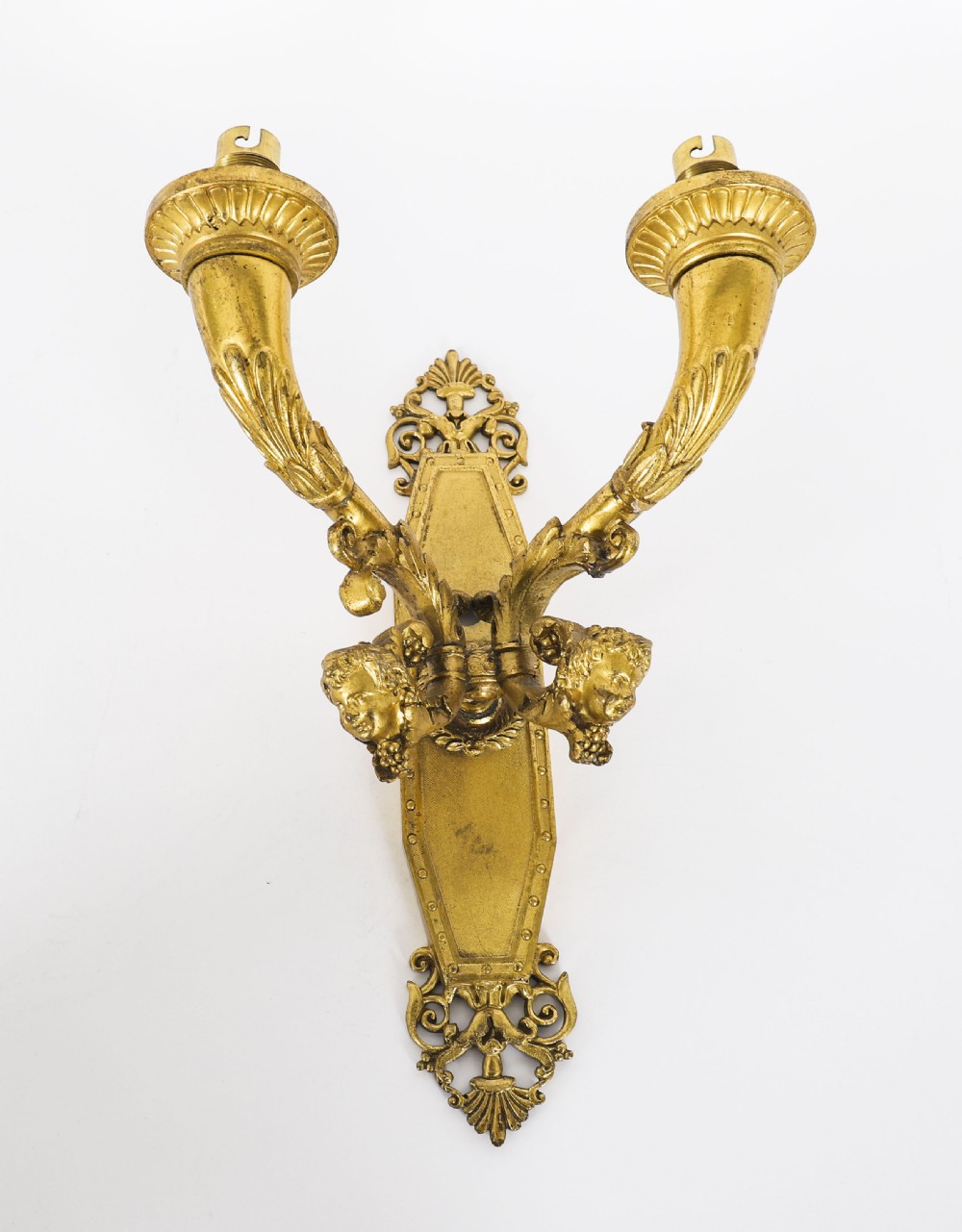 A pair of antique French Louis XIV Revival two-branch gilt bronze ormolu wall sconces decorated with cherub motifs. View IX