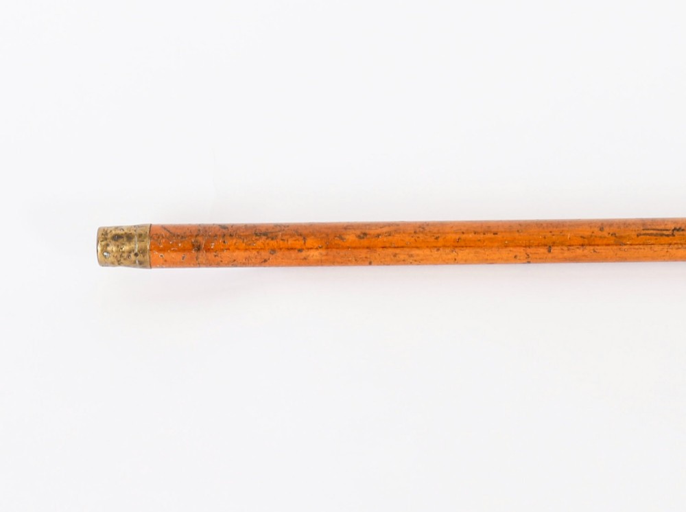 A straight polished wooden walking cane featuring a decorated 18ct gold pommel handle and a metal ferrule tip at the base. View XII