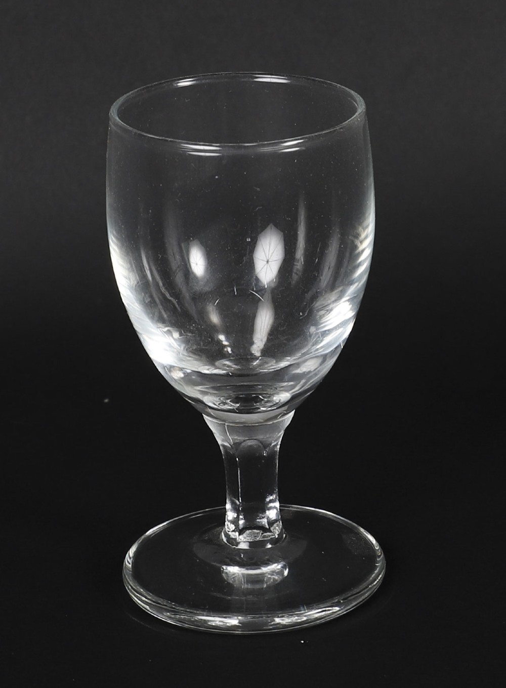 An antique blonde oak tantalus featuring three square cut-glass decanters set against a mirror back, decorative silver-plated corner mounts, and a lower drawer with a key. View XI