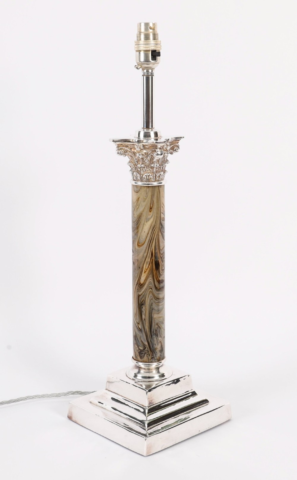 A silver-plated Corinthian column table lamp with a marbled shaft set upon a stepped square base.