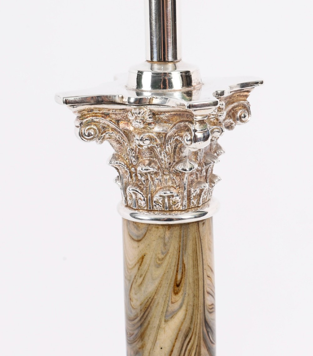 A silver-plated Corinthian column table lamp with a marbled shaft set upon a stepped square base. View VII