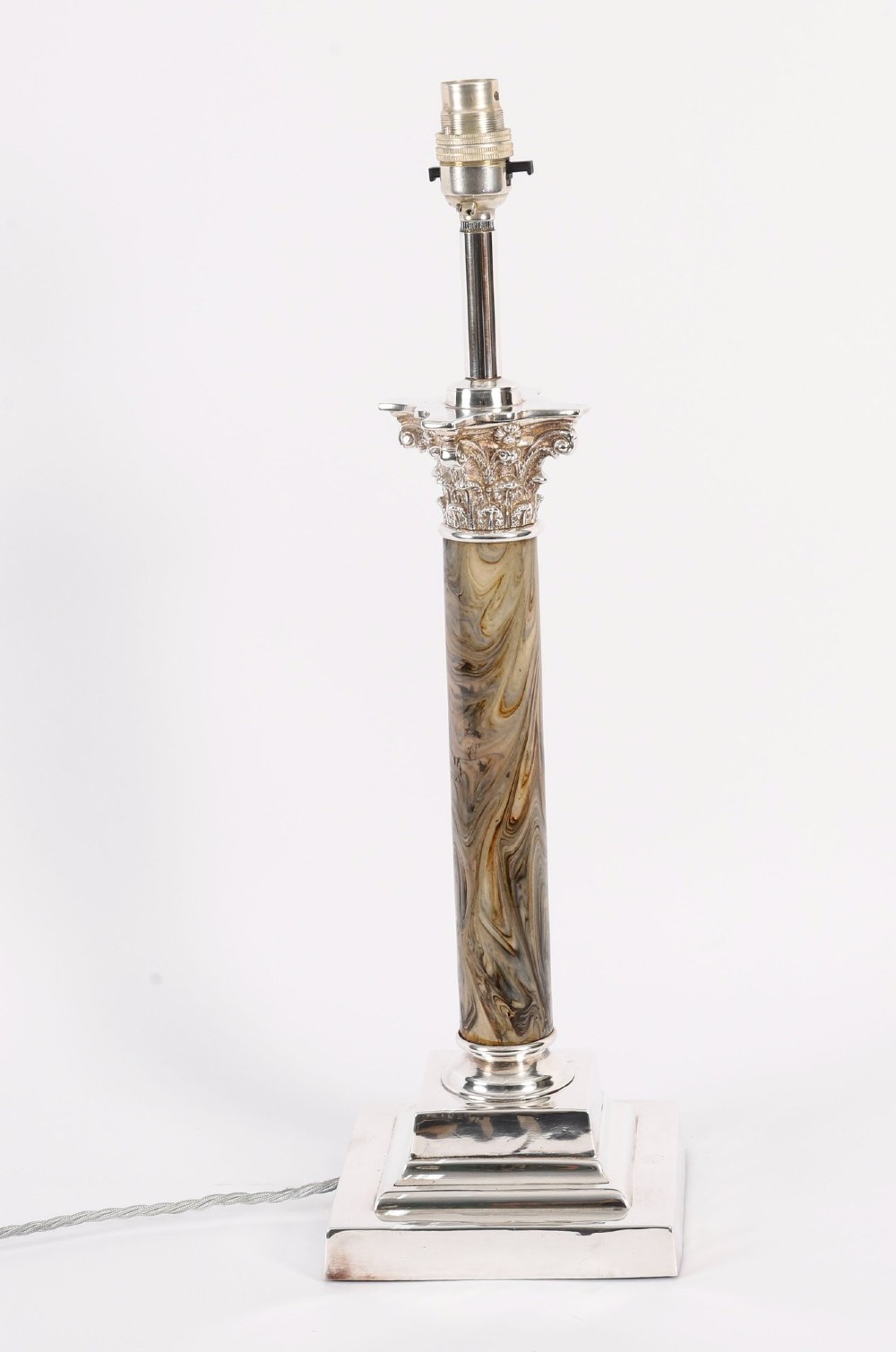 A silver-plated Corinthian column table lamp with a marbled shaft set upon a stepped square base. View XII
