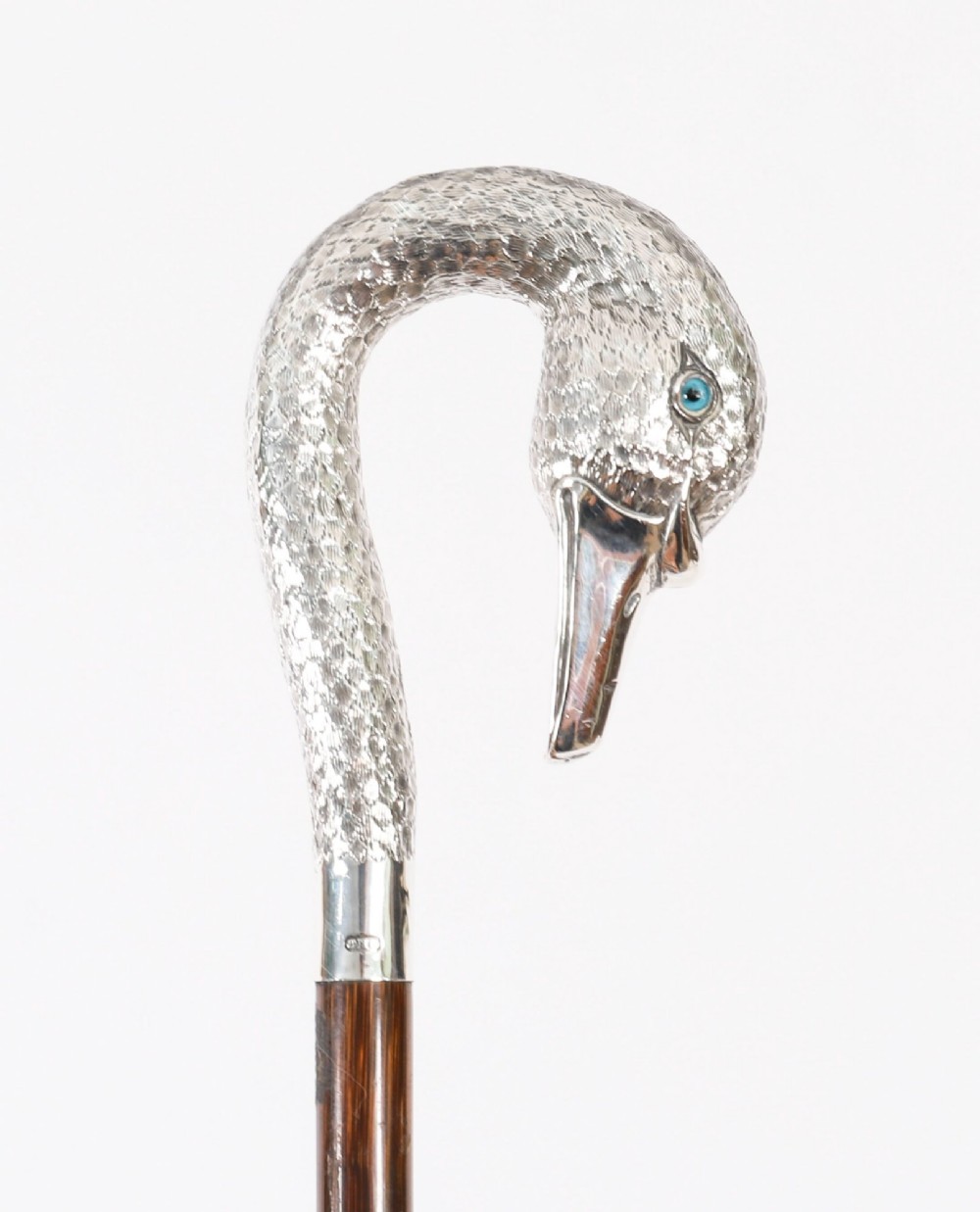 An Edwardian walking stick featuring a sterling silver swan head handle mounted on a dark wood shaft. View XIII