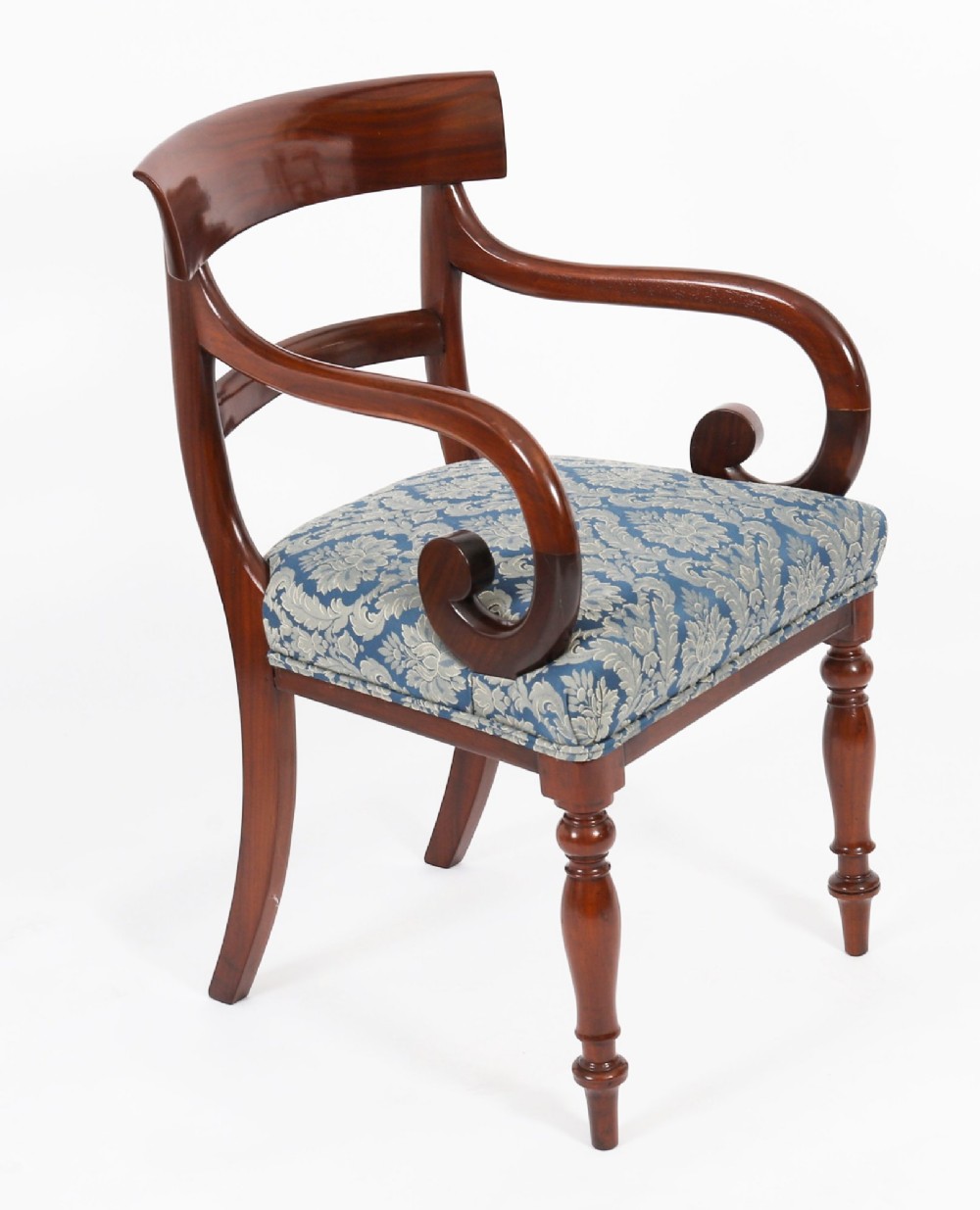 A set of eight William IV mahogany barback dining chairs with blue damask patterned fabric upholstery and turned front legs. View II