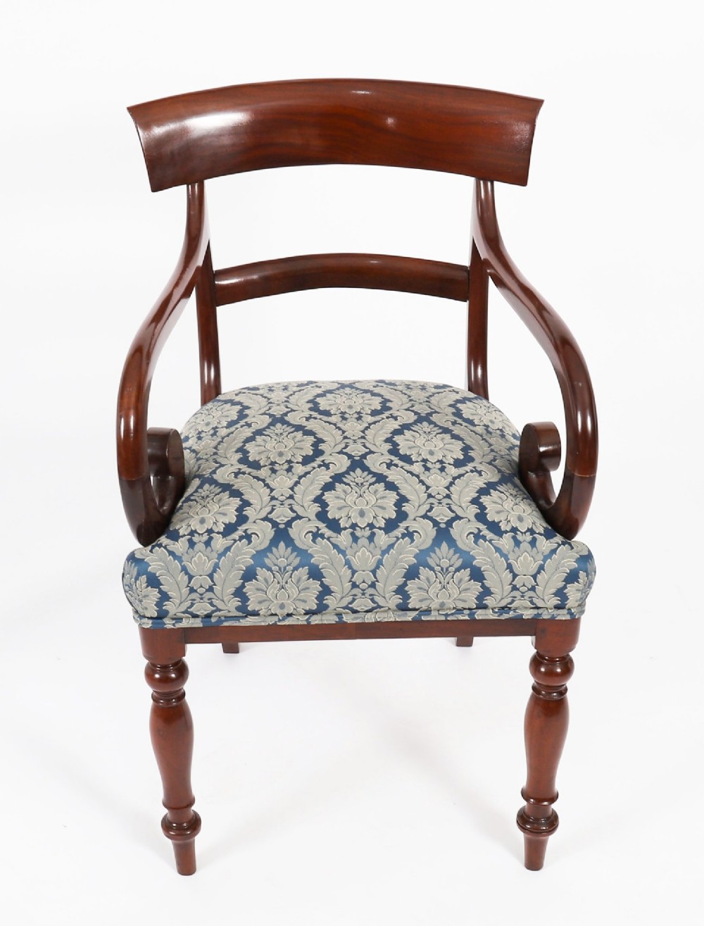 A set of eight William IV mahogany barback dining chairs with blue damask patterned fabric upholstery and turned front legs. View III