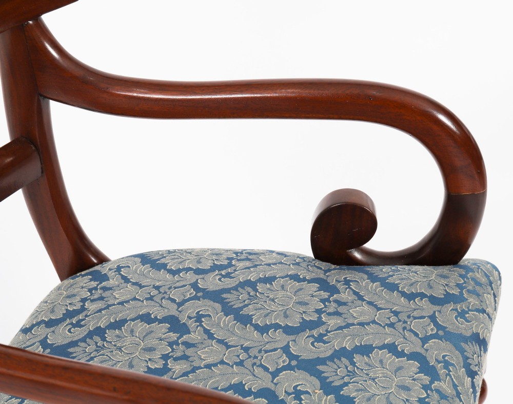 A set of eight William IV mahogany barback dining chairs with blue damask patterned fabric upholstery and turned front legs. View V