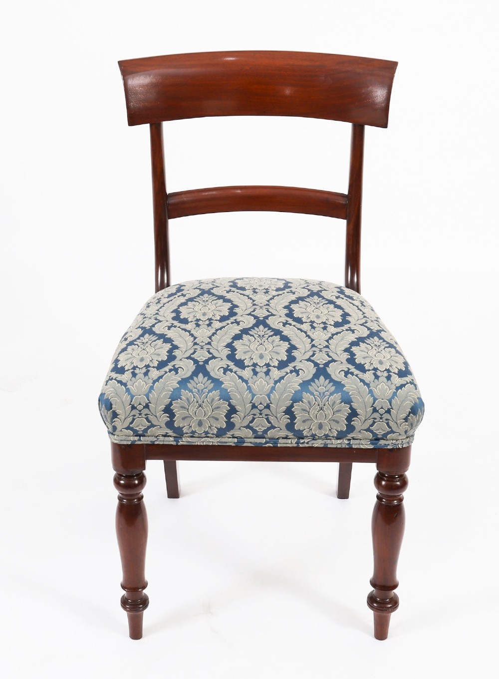 A set of eight William IV mahogany barback dining chairs with blue damask patterned fabric upholstery and turned front legs. View VIII