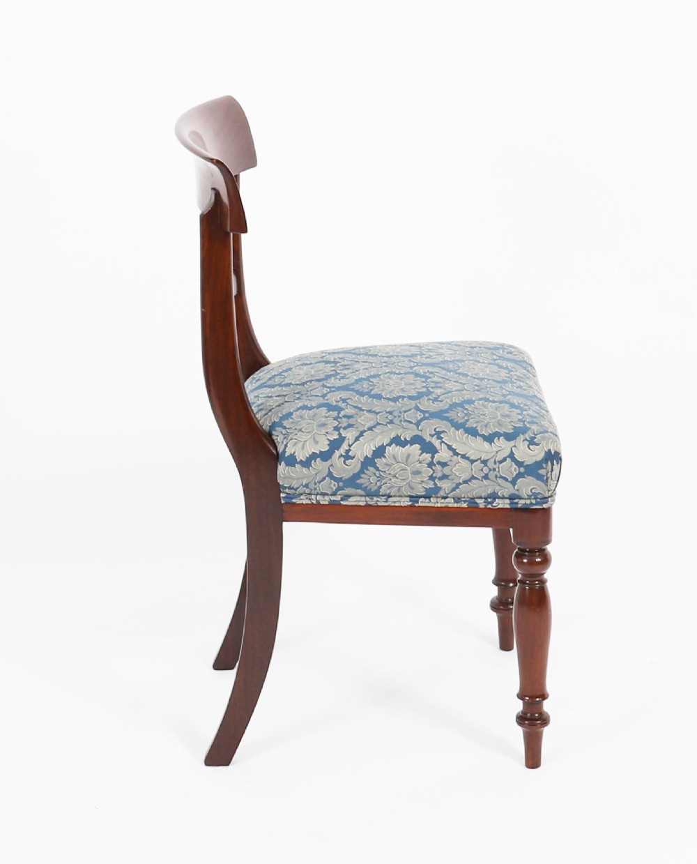 A set of eight William IV mahogany barback dining chairs with blue damask patterned fabric upholstery and turned front legs. View XII
