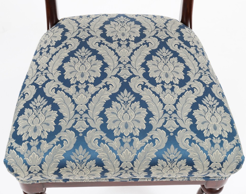 A set of eight William IV mahogany barback dining chairs with blue damask patterned fabric upholstery and turned front legs. View XIII
