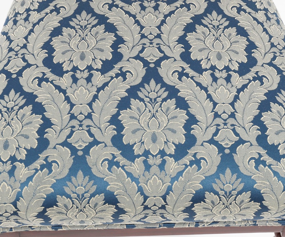 A set of eight William IV mahogany barback dining chairs with blue damask patterned fabric upholstery and turned front legs. View XIV
