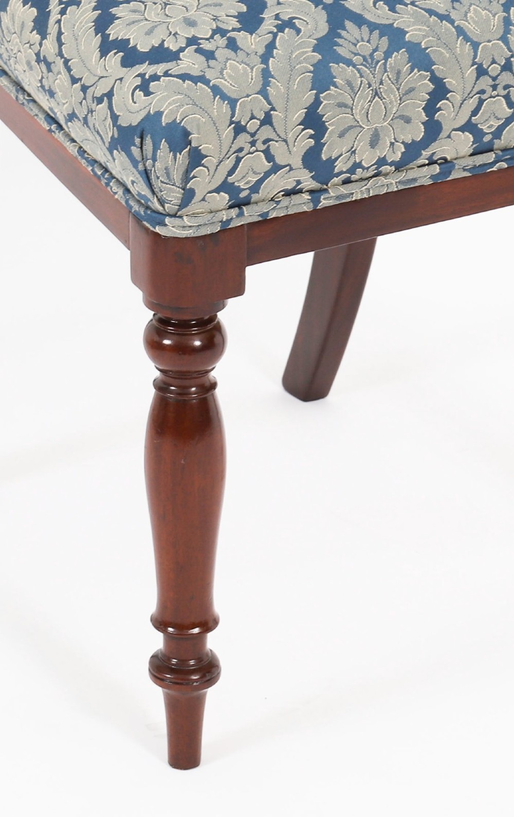A set of eight William IV mahogany barback dining chairs with blue damask patterned fabric upholstery and turned front legs. View XV