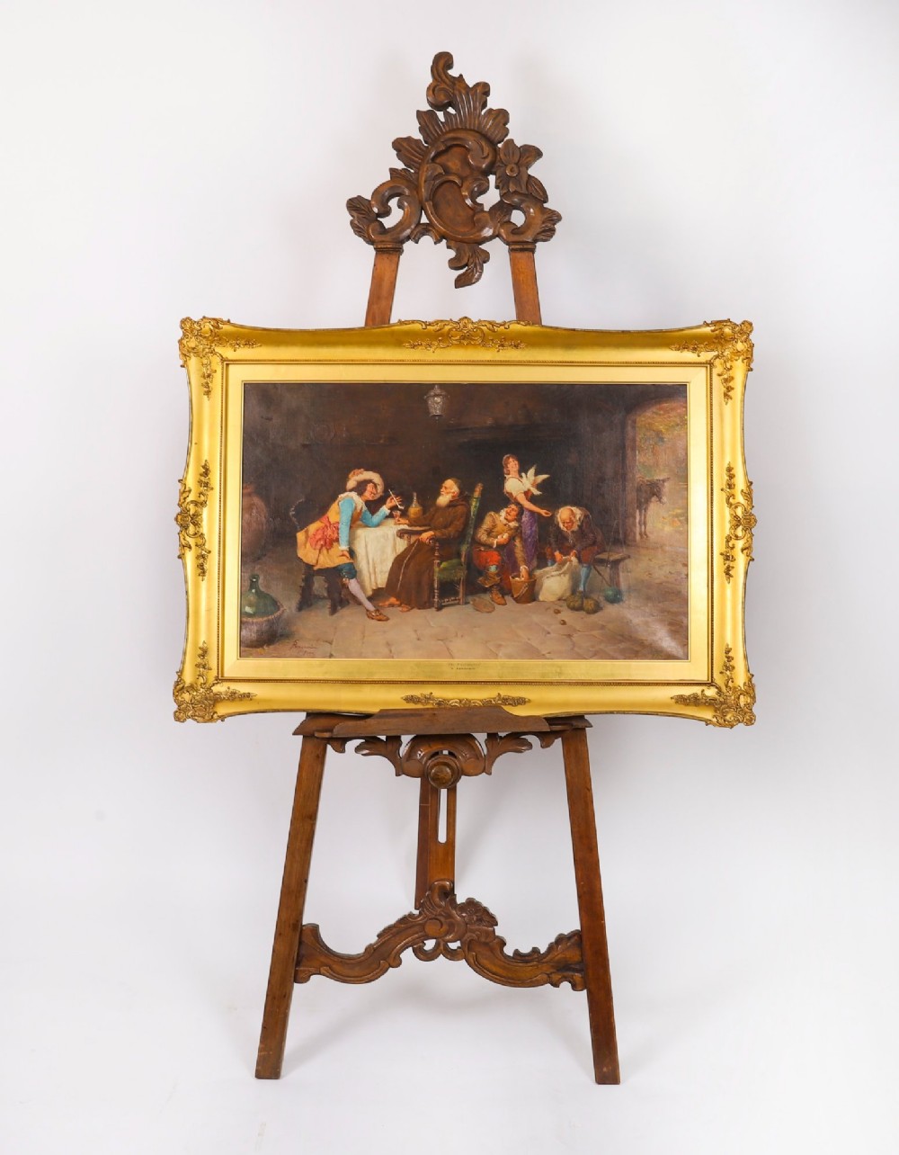 A 19th-century carved walnut artist easel featuring an ornate Rococo Revival scrollwork crest and an adjustable ledge on a tripod frame. View II