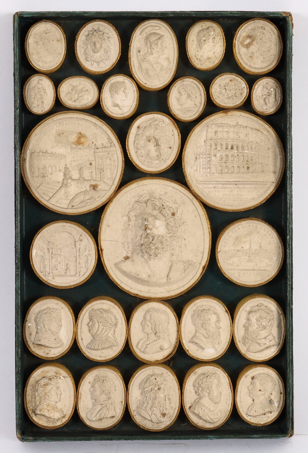 An 18th-century set of cream plaster intaglio medallions arranged in a fitted green tray beside a handwritten manuscript index lid. View III
