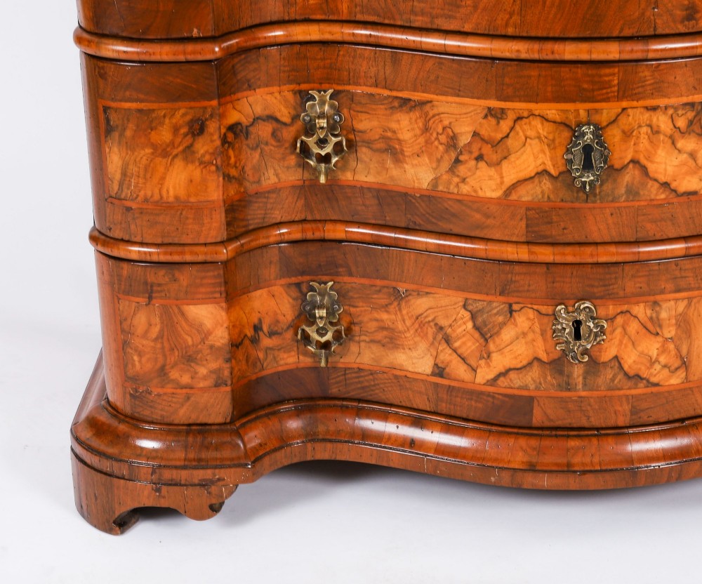 An 18th-century Venetian burr walnut bureau bookcase featuring a shaped top pediment with mirrored inset, twin mirrored cabinet doors, a slant-front writing slope, and three serpentine drawers. View VII