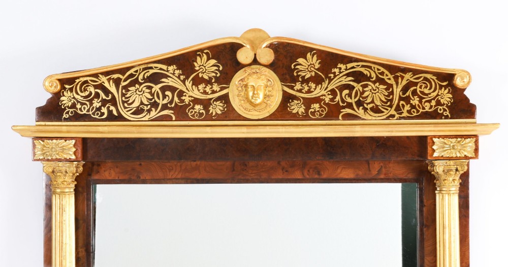 A nineteenth-century rectangular French burr walnut mirror featuring gilded fluted pilasters, classical foliate cresting with a central mask motif, and gilt rosettes. View II