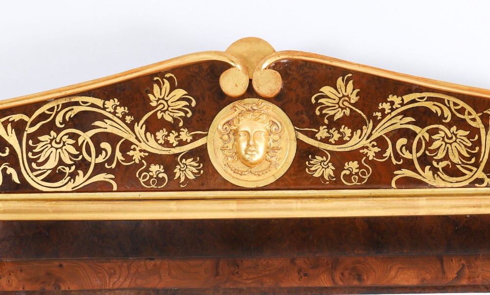 A nineteenth-century rectangular French burr walnut mirror featuring gilded fluted pilasters, classical foliate cresting with a central mask motif, and gilt rosettes. View III