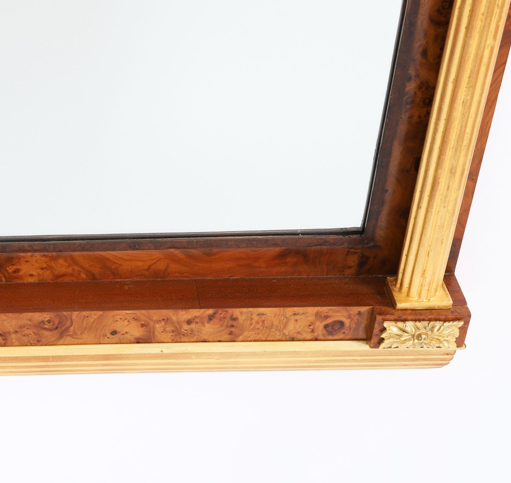 A nineteenth-century rectangular French burr walnut mirror featuring gilded fluted pilasters, classical foliate cresting with a central mask motif, and gilt rosettes. View VII