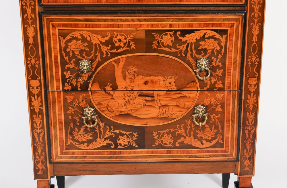 An 18th-century Italian Neoclassical walnut commodino featuring intricate foliate and pictorial marquetry inlay, three drawers with lion head ring pulls, and square tapered legs. View III
