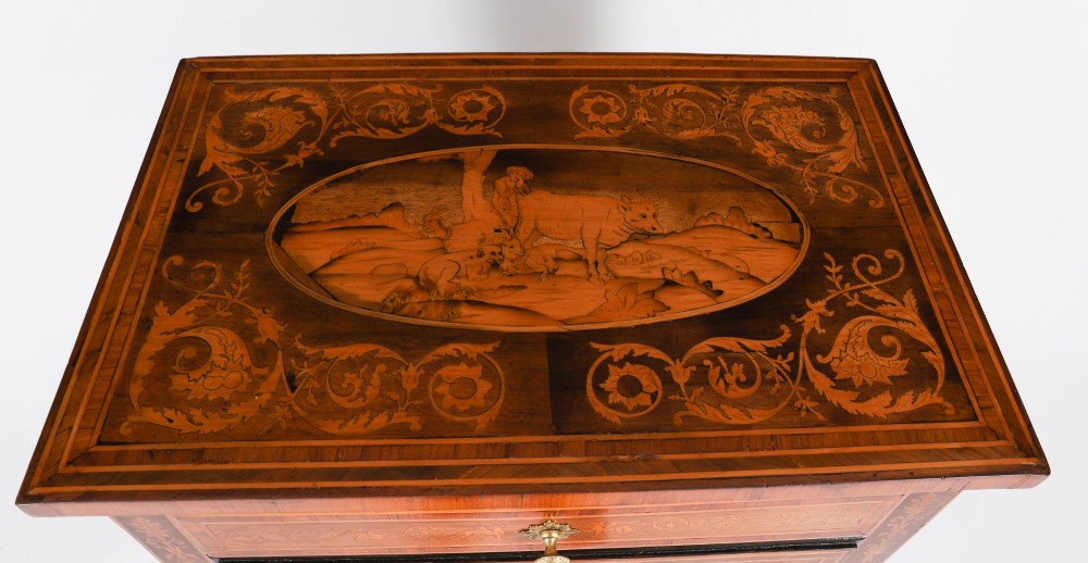 An 18th-century Italian Neoclassical walnut commodino featuring intricate foliate and pictorial marquetry inlay, three drawers with lion head ring pulls, and square tapered legs. View IV
