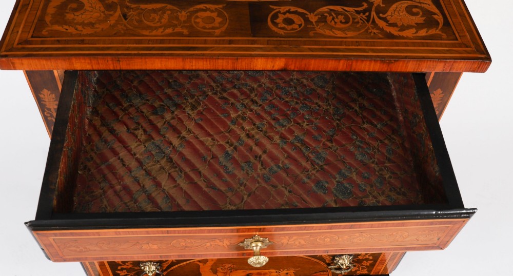 An 18th-century Italian Neoclassical walnut commodino featuring intricate foliate and pictorial marquetry inlay, three drawers with lion head ring pulls, and square tapered legs. View VIII
