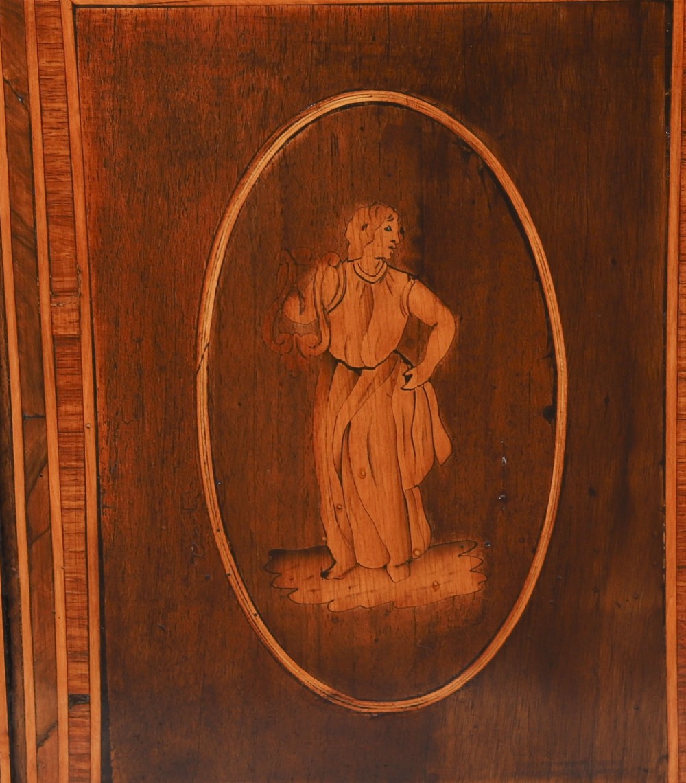 An 18th-century Italian Neoclassical walnut commodino featuring intricate foliate and pictorial marquetry inlay, three drawers with lion head ring pulls, and square tapered legs. View XI