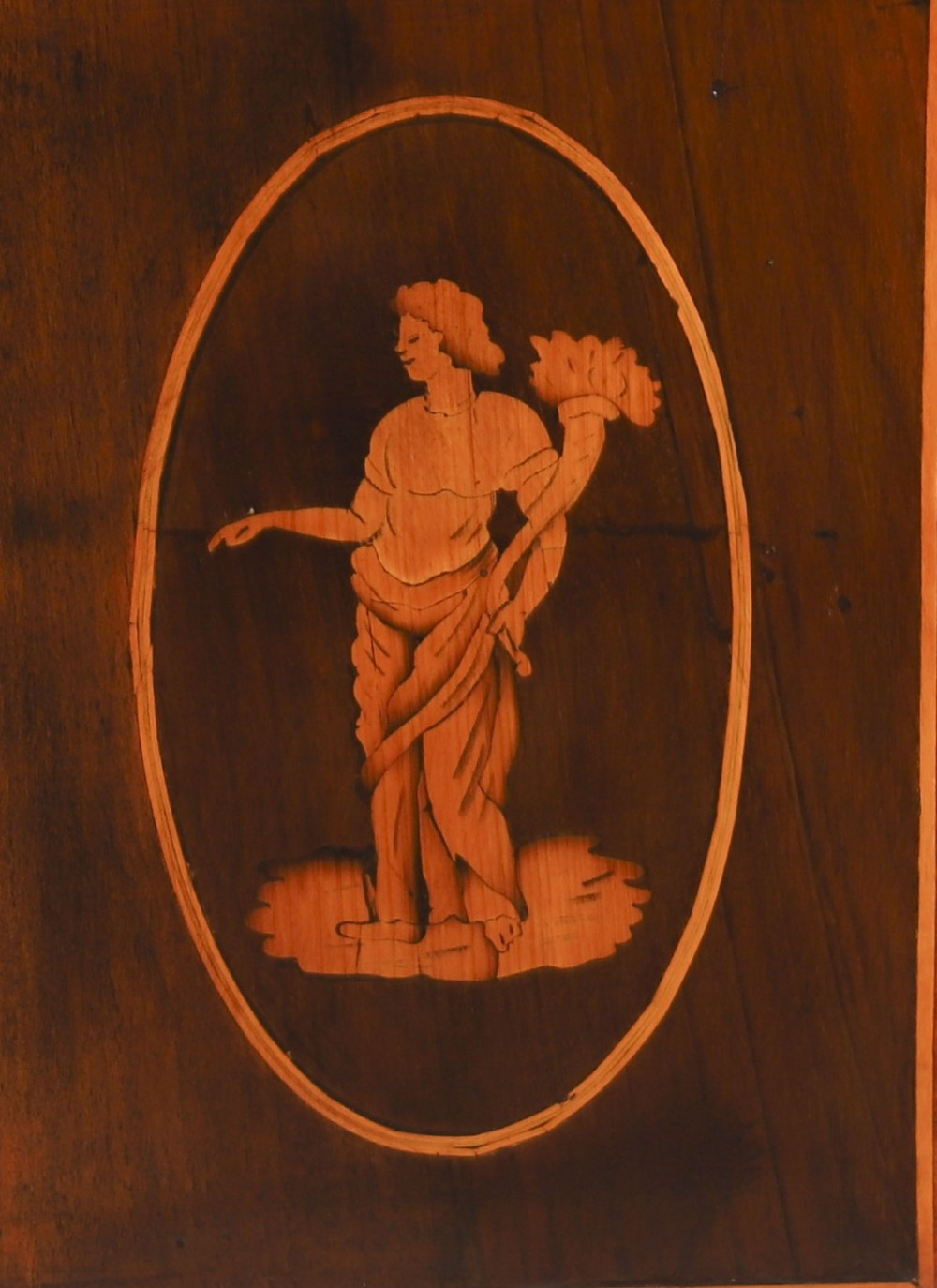 An 18th-century Italian Neoclassical walnut commodino featuring intricate foliate and pictorial marquetry inlay, three drawers with lion head ring pulls, and square tapered legs. View XIII
