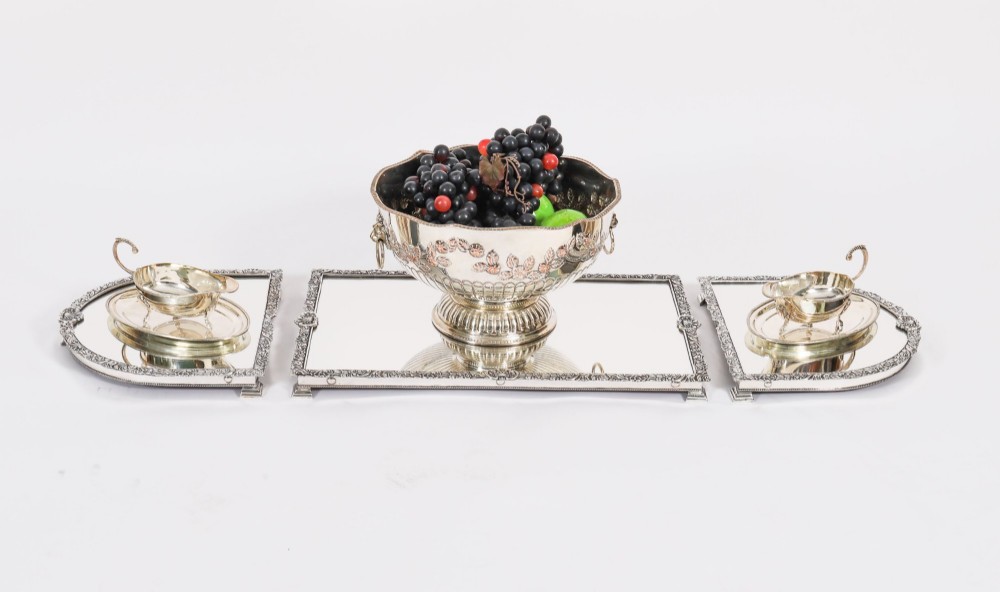 A three-piece antique French silver-plated mirrored surtout de table with ornate floral and shell border mouldings. View II
