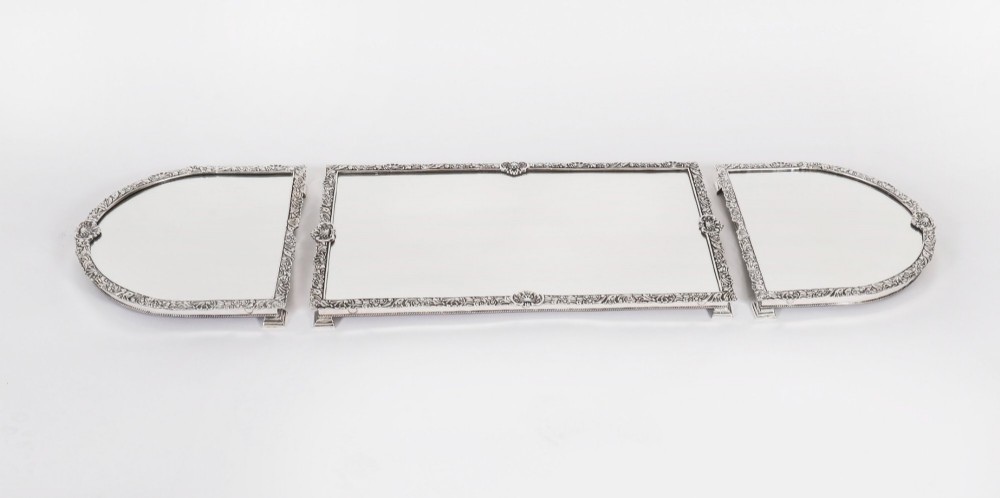 A three-piece antique French silver-plated mirrored surtout de table with ornate floral and shell border mouldings. View III