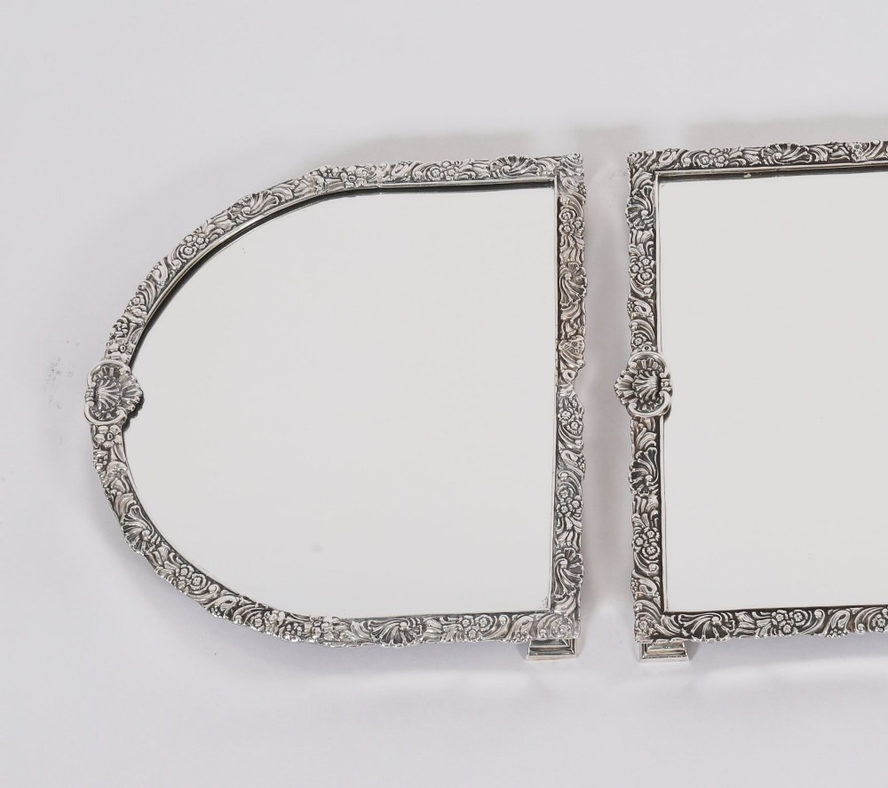 A three-piece antique French silver-plated mirrored surtout de table with ornate floral and shell border mouldings. View IV