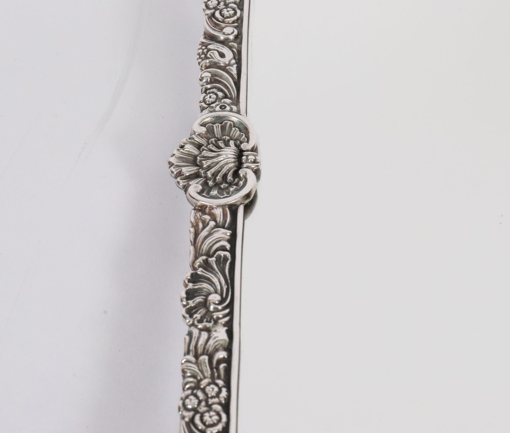 A three-piece antique French silver-plated mirrored surtout de table with ornate floral and shell border mouldings. View VIII