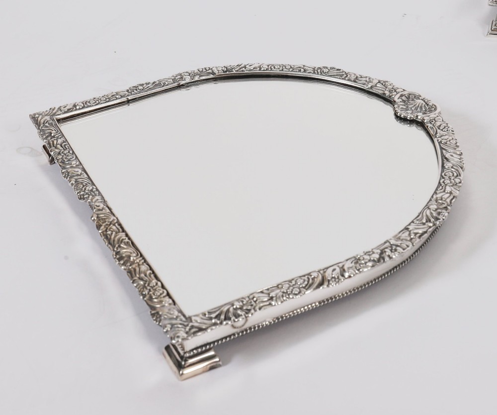 A three-piece antique French silver-plated mirrored surtout de table with ornate floral and shell border mouldings. View XII