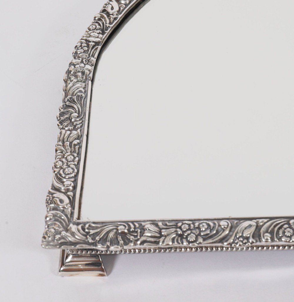 A three-piece antique French silver-plated mirrored surtout de table with ornate floral and shell border mouldings. View XIII