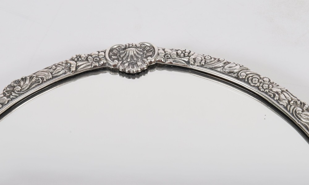 A three-piece antique French silver-plated mirrored surtout de table with ornate floral and shell border mouldings. View XIV
