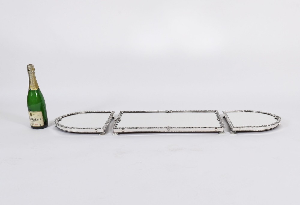 A three-piece antique French silver-plated mirrored surtout de table with ornate floral and shell border mouldings. View XV