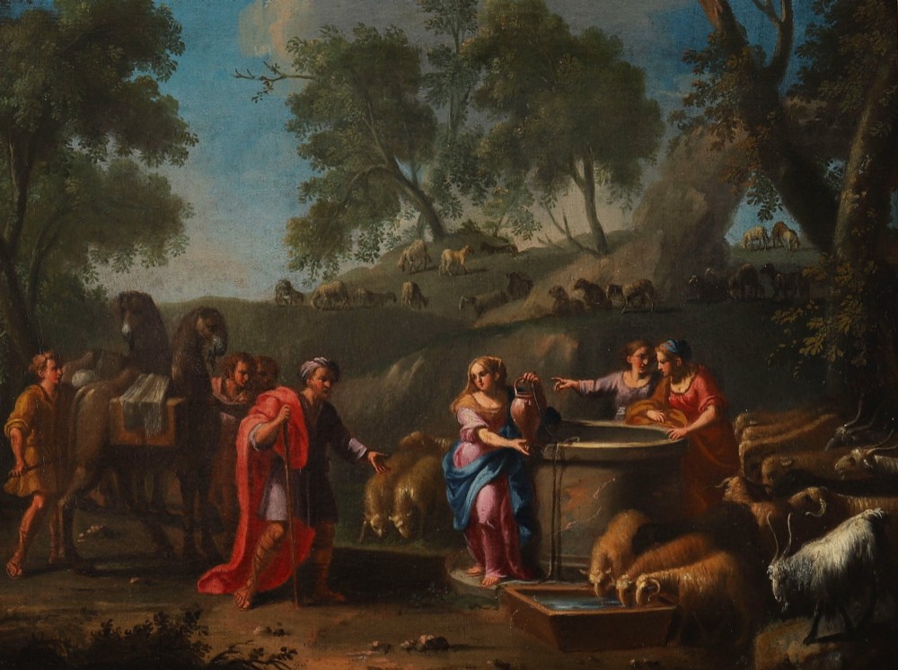A 17th-century Italian oil painting on board depicting figures and livestock gathered at a well, set within a landscape and surrounded by a moulded gold frame. View III