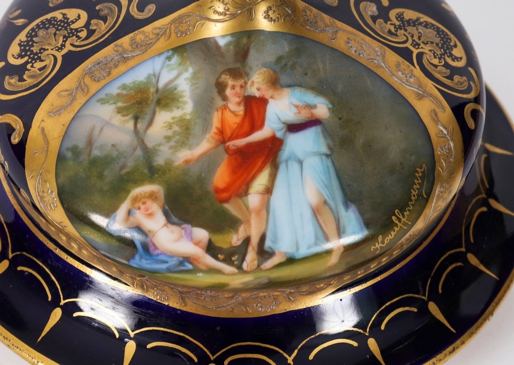 A pair of large 19th-century cobalt blue porcelain vases on matching square pedestals, featuring gilt scrollwork and hand-painted classical mythological scenes. View VIII
