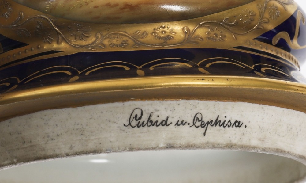 A pair of large 19th-century cobalt blue porcelain vases on matching square pedestals, featuring gilt scrollwork and hand-painted classical mythological scenes. View XII