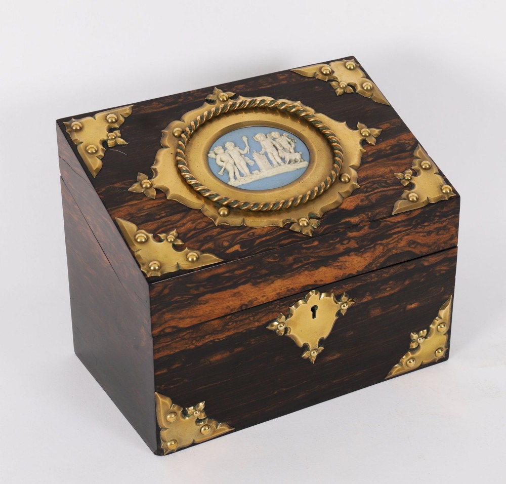 A three-piece Victorian coromandel wood desk set featuring gilt ormolu mounts, brass strapwork, and light blue oval jasperware plaques. View II