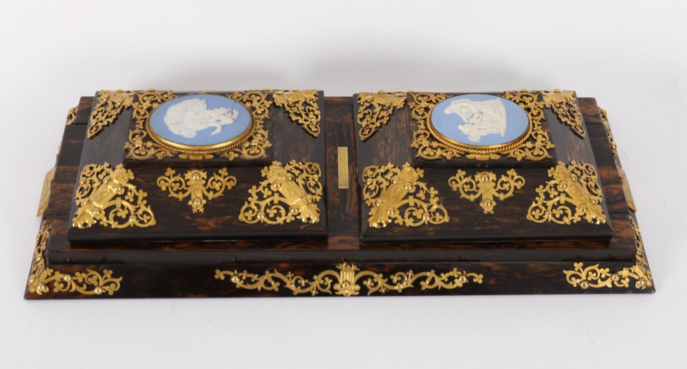 A three-piece Victorian coromandel wood desk set featuring gilt ormolu mounts, brass strapwork, and light blue oval jasperware plaques. View X