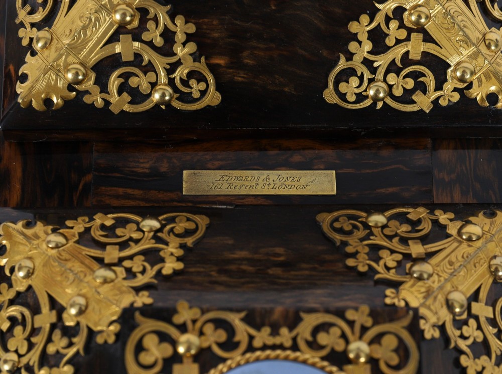 A three-piece Victorian coromandel wood desk set featuring gilt ormolu mounts, brass strapwork, and light blue oval jasperware plaques. View XIII