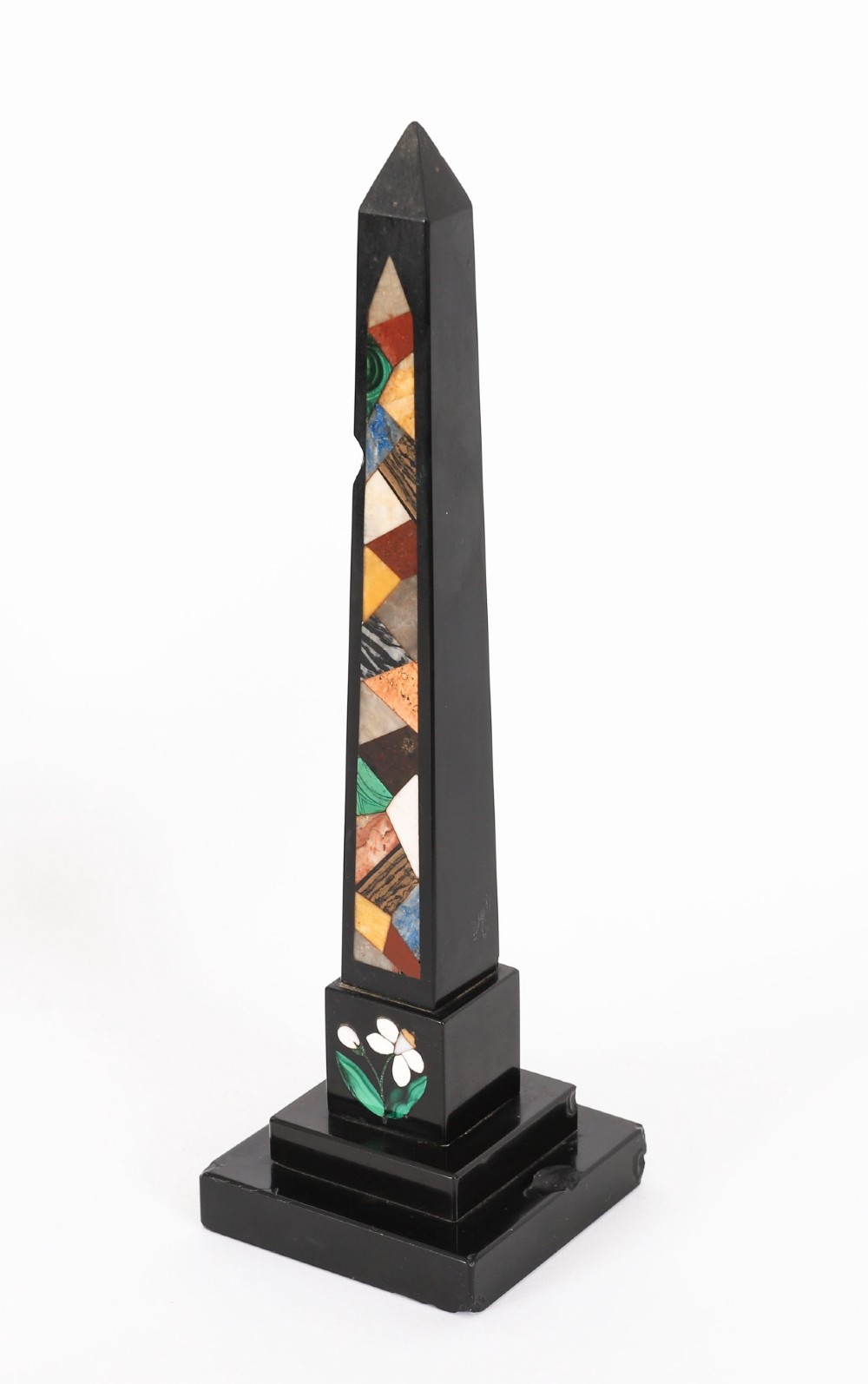 A pair of antique black marble obelisks featuring colourful geometric stone inlays along the shaft and floral inlaid detail on stepped square bases. View IX