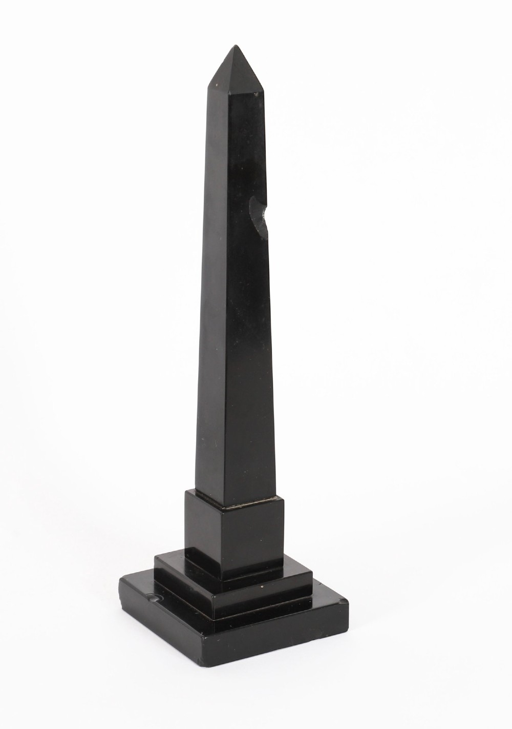 A pair of antique black marble obelisks featuring colourful geometric stone inlays along the shaft and floral inlaid detail on stepped square bases. View X