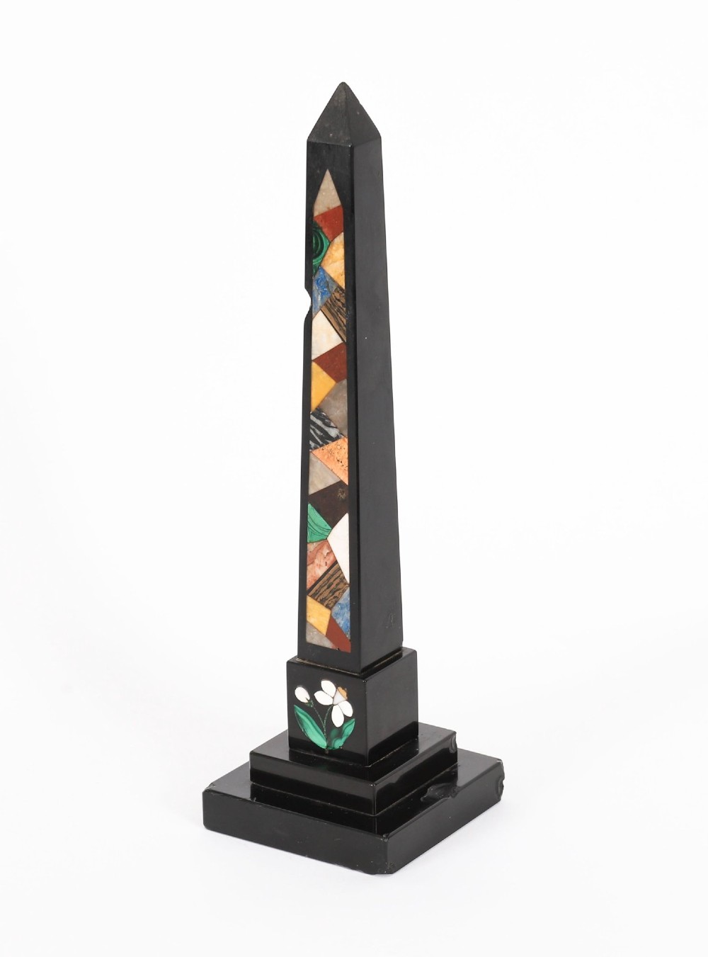 A pair of antique black marble obelisks featuring colourful geometric stone inlays along the shaft and floral inlaid detail on stepped square bases. View XI