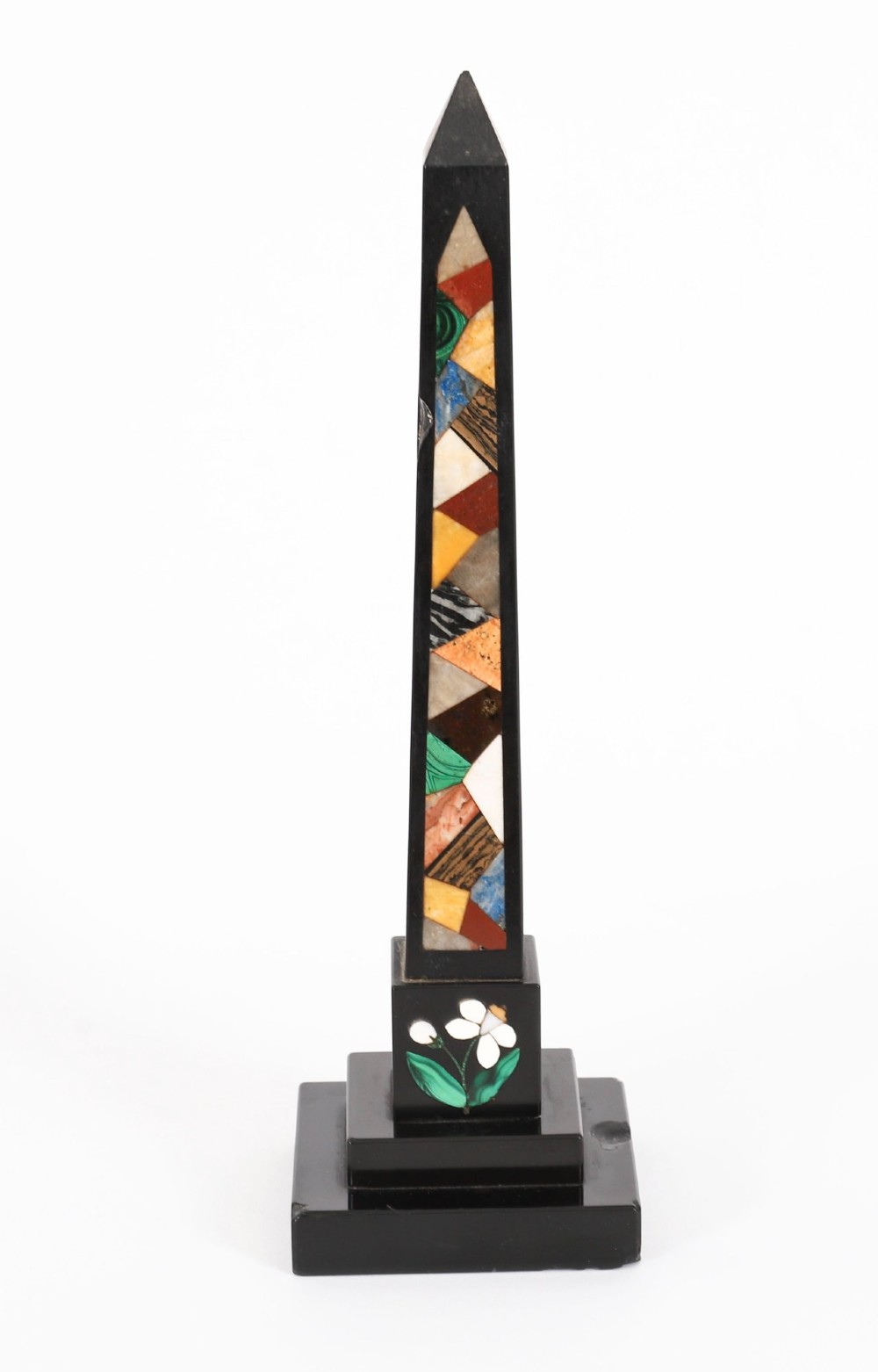 A pair of antique black marble obelisks featuring colourful geometric stone inlays along the shaft and floral inlaid detail on stepped square bases. View XIV