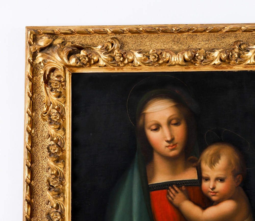An early 19th-century oil painting depicting the Virgin Mary holding the infant Christ, framed in an ornate carved gold leaf frame. View VII