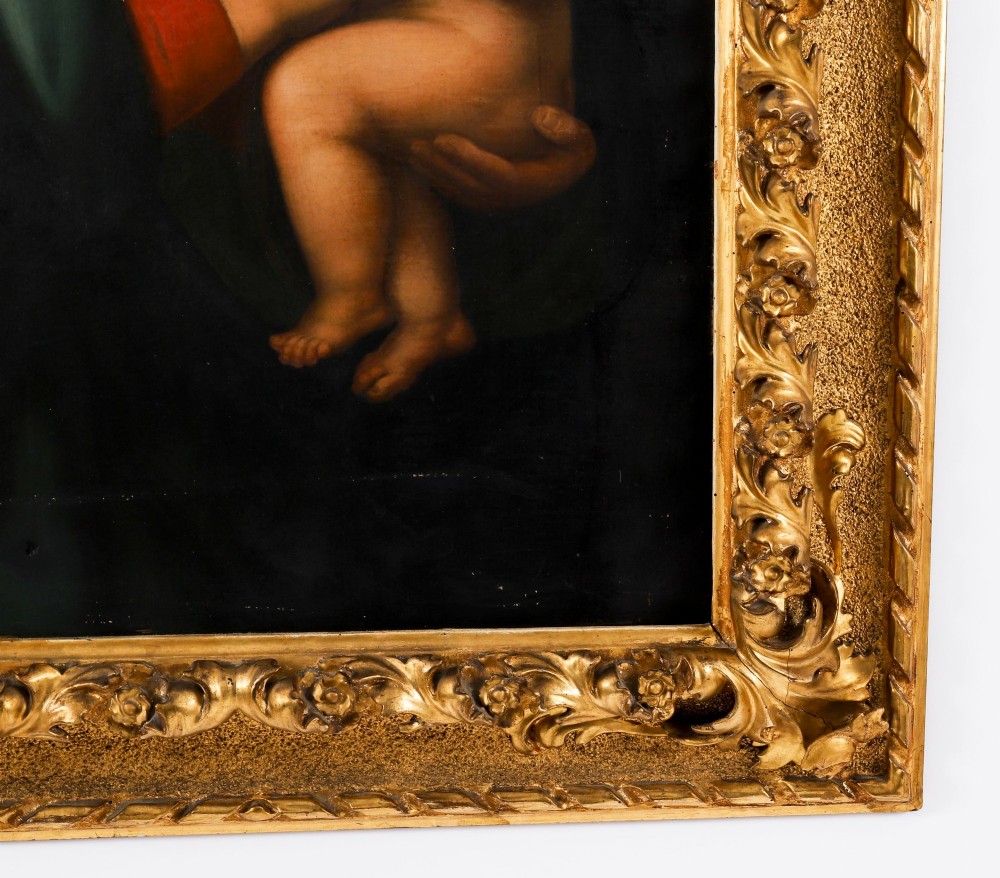 An early 19th-century oil painting depicting the Virgin Mary holding the infant Christ, framed in an ornate carved gold leaf frame. View VIII
