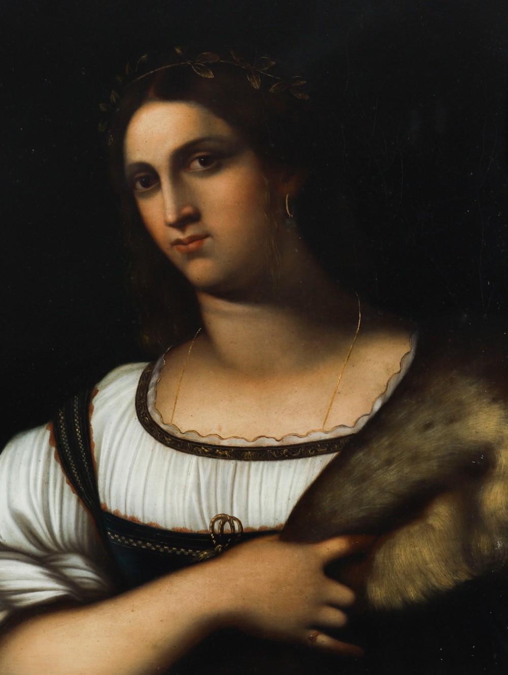 An early 19th-century portrait oil painting of a woman in classical attire set within a heavily carved gold giltwood frame. View III