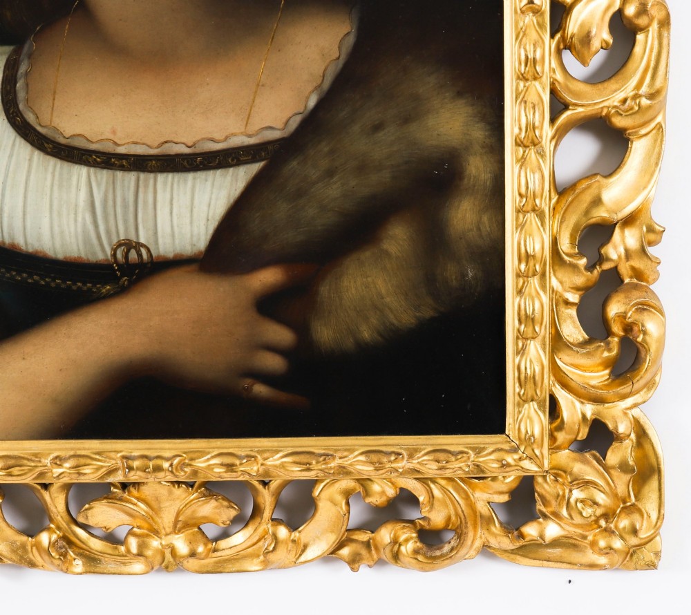 An early 19th-century portrait oil painting of a woman in classical attire set within a heavily carved gold giltwood frame. View VII